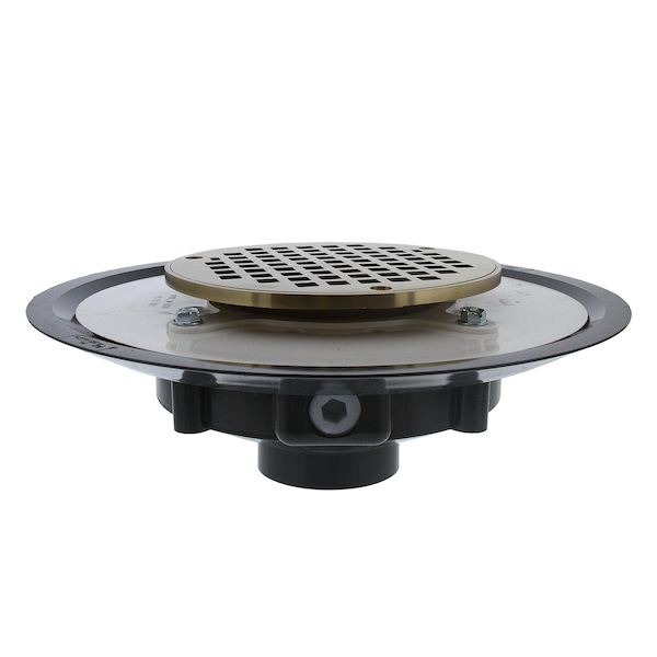 Jones Stephens 2in. Heavy Duty PVC Drain Base with 3-1/2in. Metal Spud and 6in. Polished Brass Strainer D50028 - main